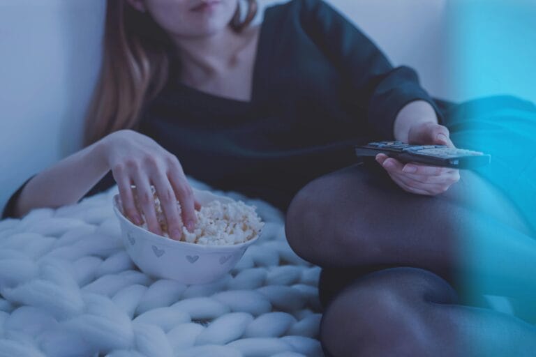 Xtreme HD IPTV Woman relaxing with popcorn and remote