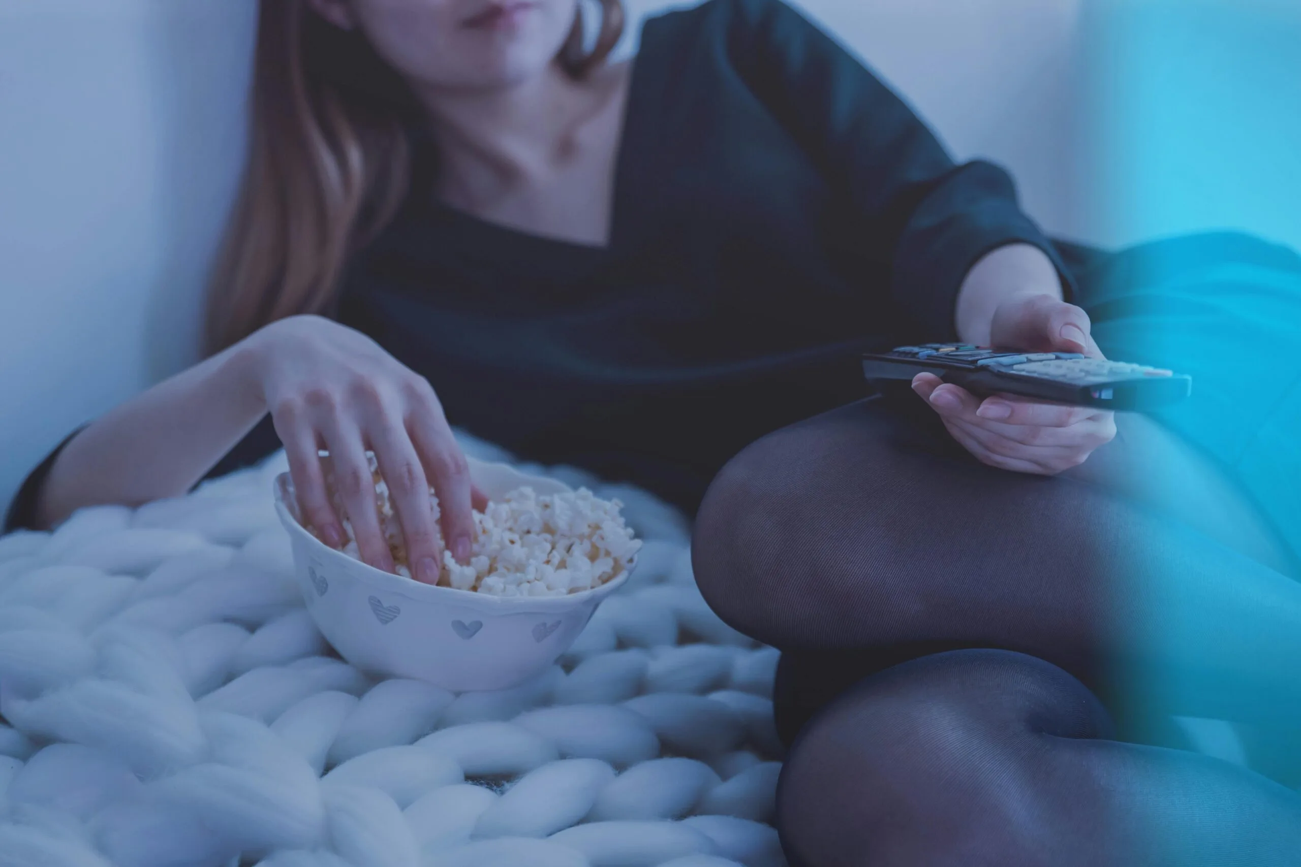 Xtreme HD IPTV Woman relaxing with popcorn and remote